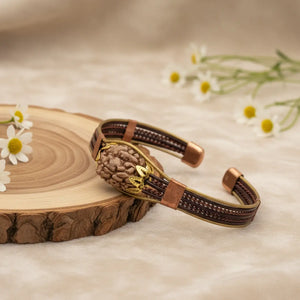 3 Mukhi Copper Rudraksha Bracelet with Brass Accents — close-up macro showing surface texture and natural lines