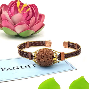 4 Mukhi Copper Rudraksha Bracelet with Brass Accents — main bead view showing mukhi (faces)