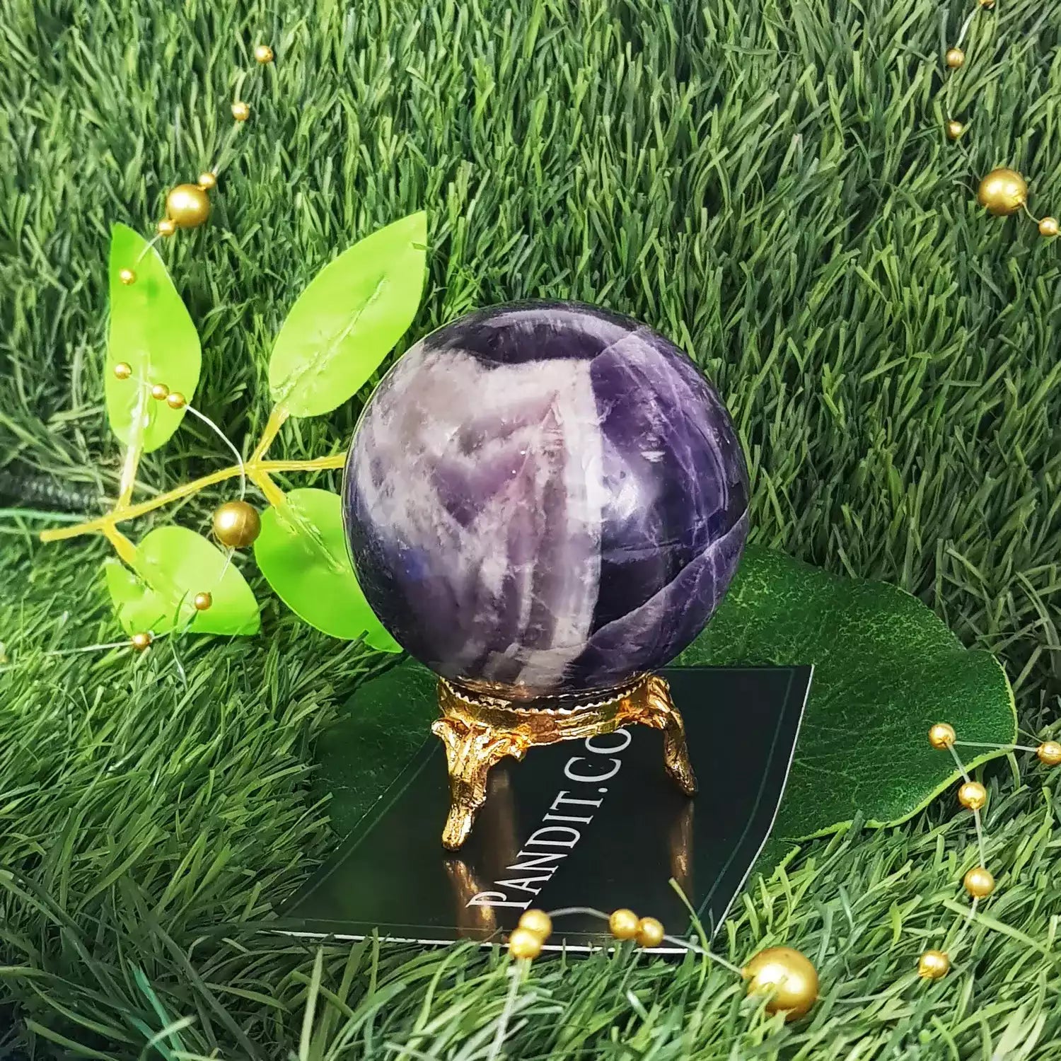 Amethyst Crystal Ball — close-up showing internal clarity and inclusions
