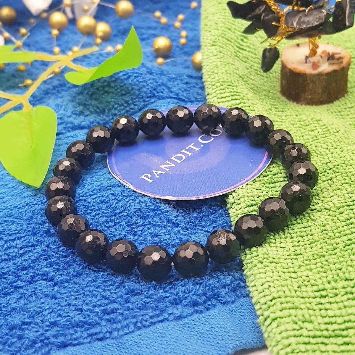 Black Tourmaline Diamond Cut Bracelet — front view of bracelet showing beads and stringing