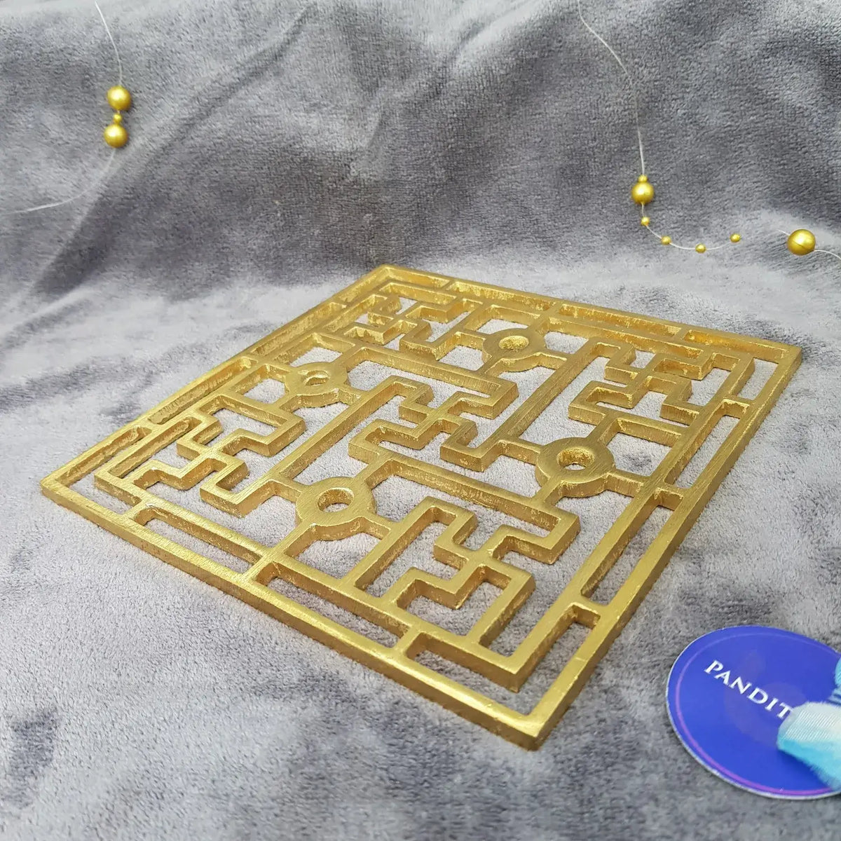 Brass Swastik Plate Yantra — close-up detail showing texture and craftsmanship