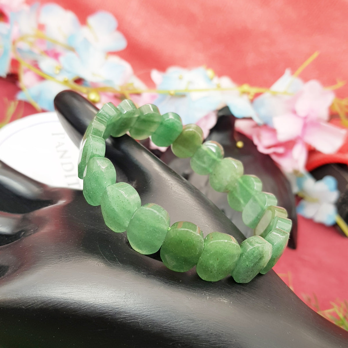 Green Aventurine Oval Faceted Bracelet — front view of bracelet showing beads and stringing