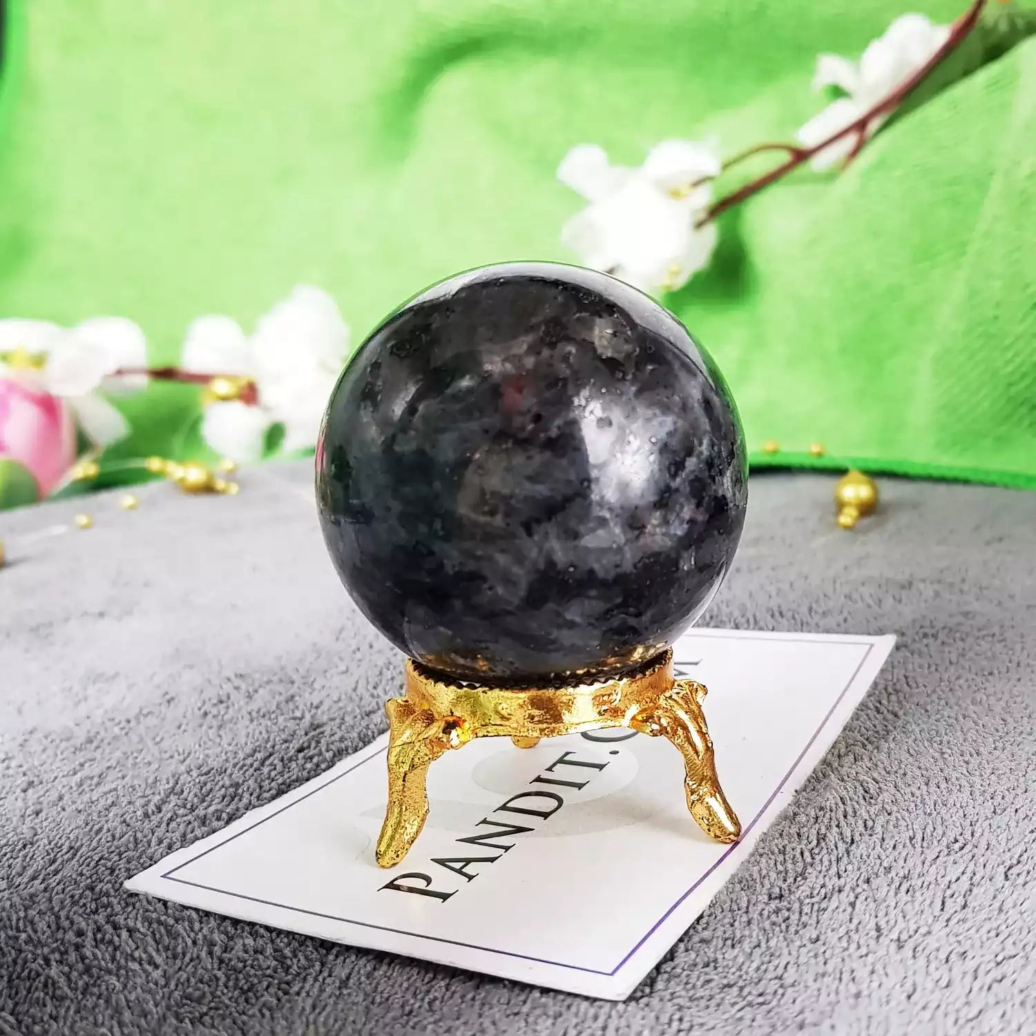 Larvikite Crystal Ball — close-up showing internal clarity and inclusions