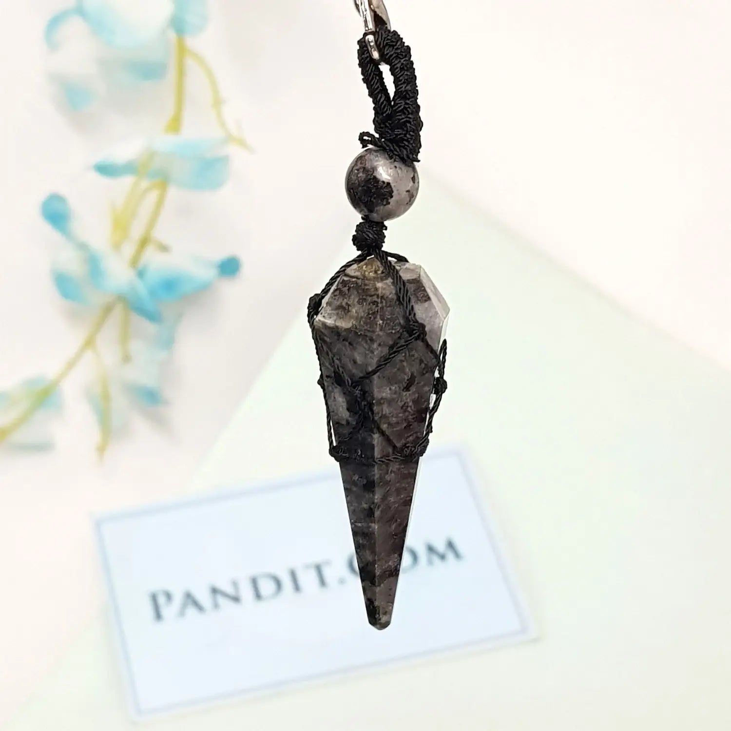 Larvikite Dowsing Pendulum — close-up of crystal point and faceting