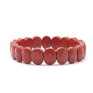 Red Jasper Oval Faceted Bracelet — comparison size reference next to coin