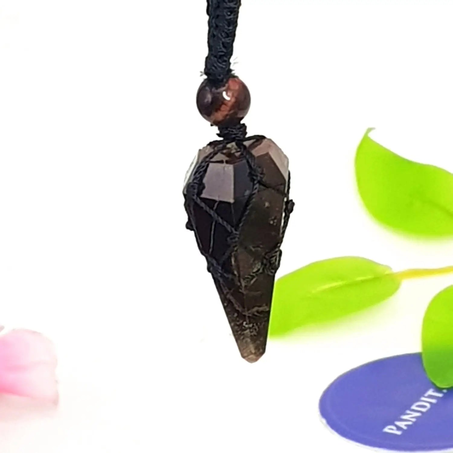 Red Tiger Dowsing Pendulum — close-up of crystal point and faceting