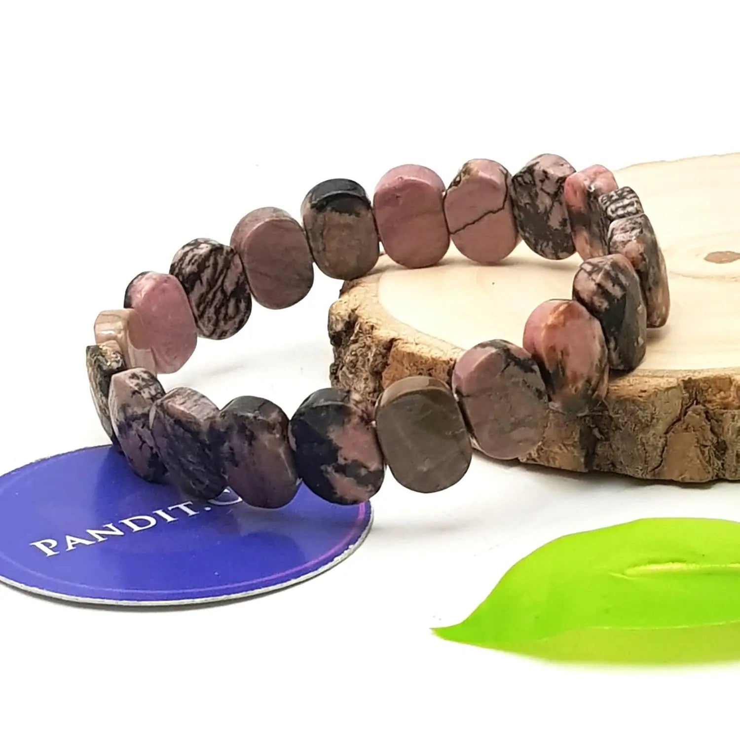 Rhodonite Crystal Oval Faceted Bracelet — close-up of Rhodonite Crystal Oval Faceted stones revealing natural patterns