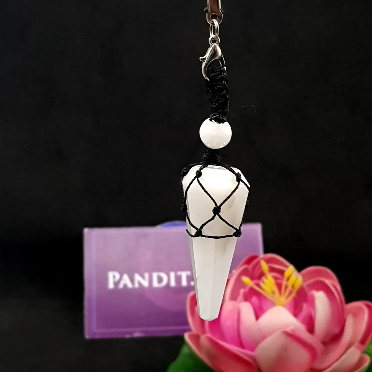 Snow Quartz Dowsing Pendulum — close-up of crystal point and faceting