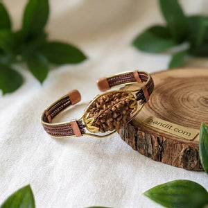 2 Mukhi Copper Rudraksha Bracelet with Brass Accents — close-up macro showing surface texture and natural lines