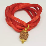 4 Mukhi Rudraksha — close-up macro showing surface texture and natural lines