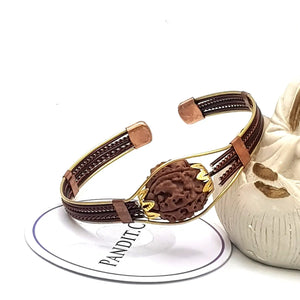 5 Mukhi Copper Rudraksha Bracelet with Brass Accents — close-up macro showing surface texture and natural lines