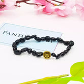 Black Obsidian Tumble Bracelet — front view of bracelet showing beads and stringing