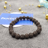 Black Rudraksha Bracelet — main bead view showing mukhi (faces)