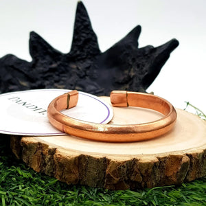 Copper Bracelet — comparison size reference next to coin