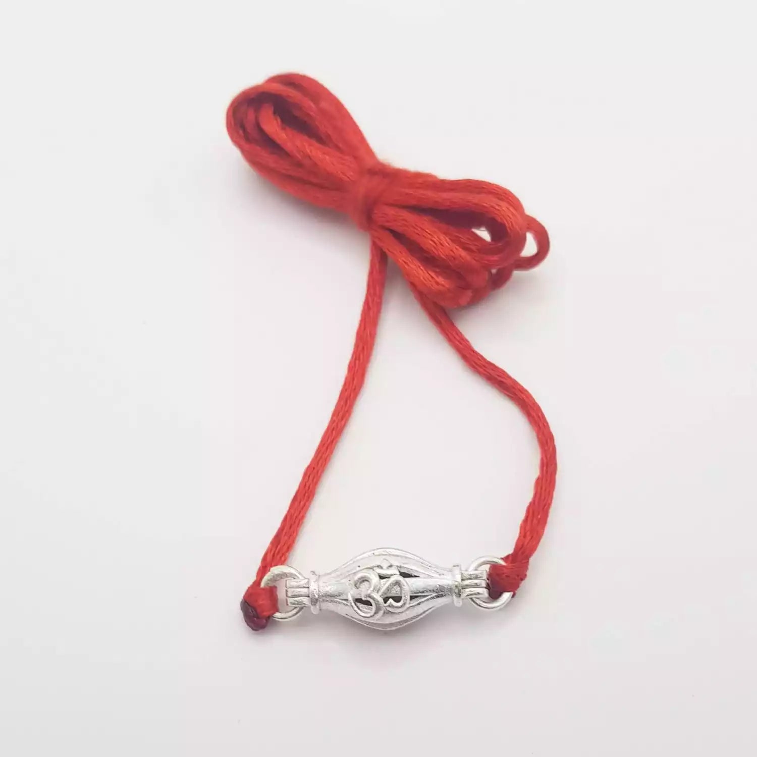 1 Mukhi Rudraksha — bead worn on red thread